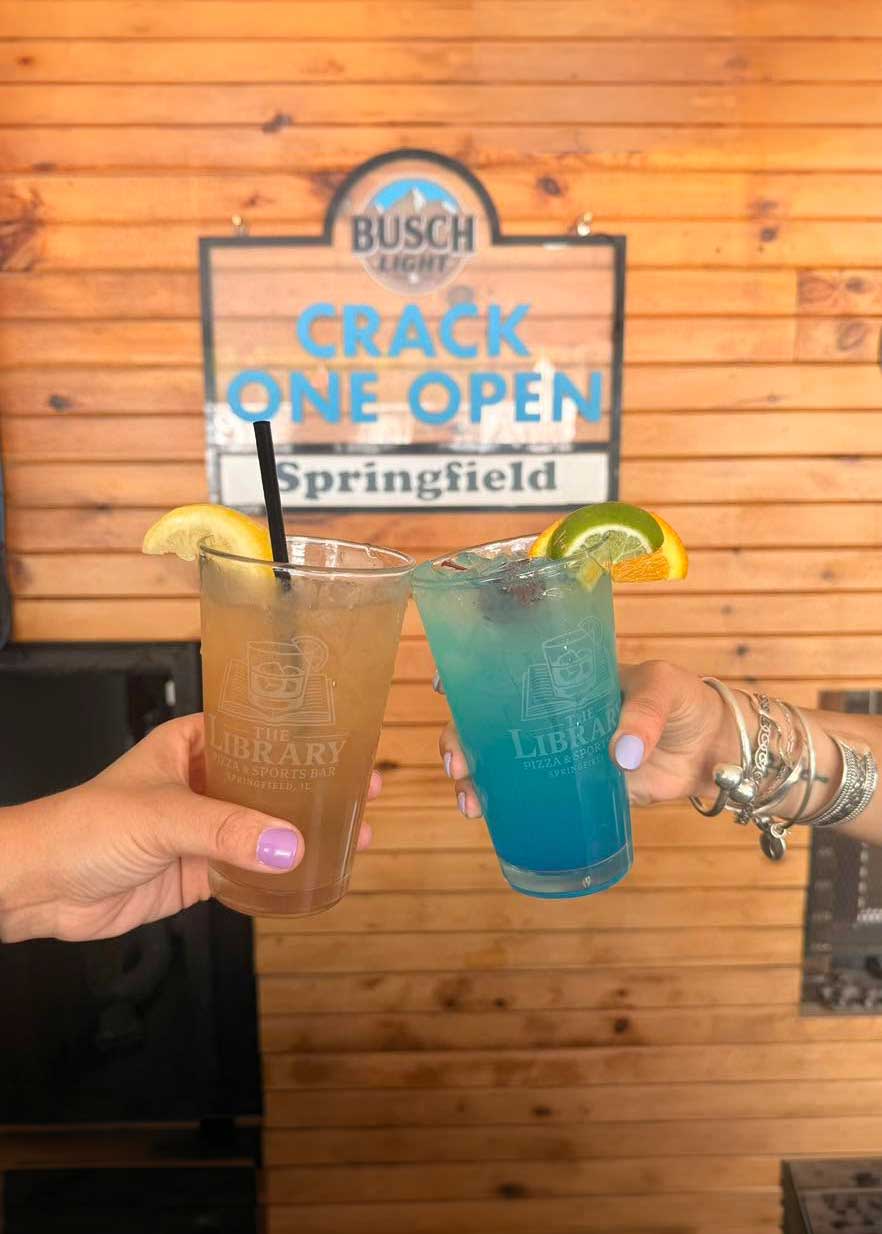 Cheers with signature Library cocktails